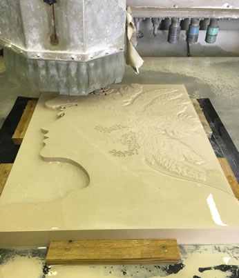 The team at A.F Jones Stonemasons cutting the Portland Stone Panel